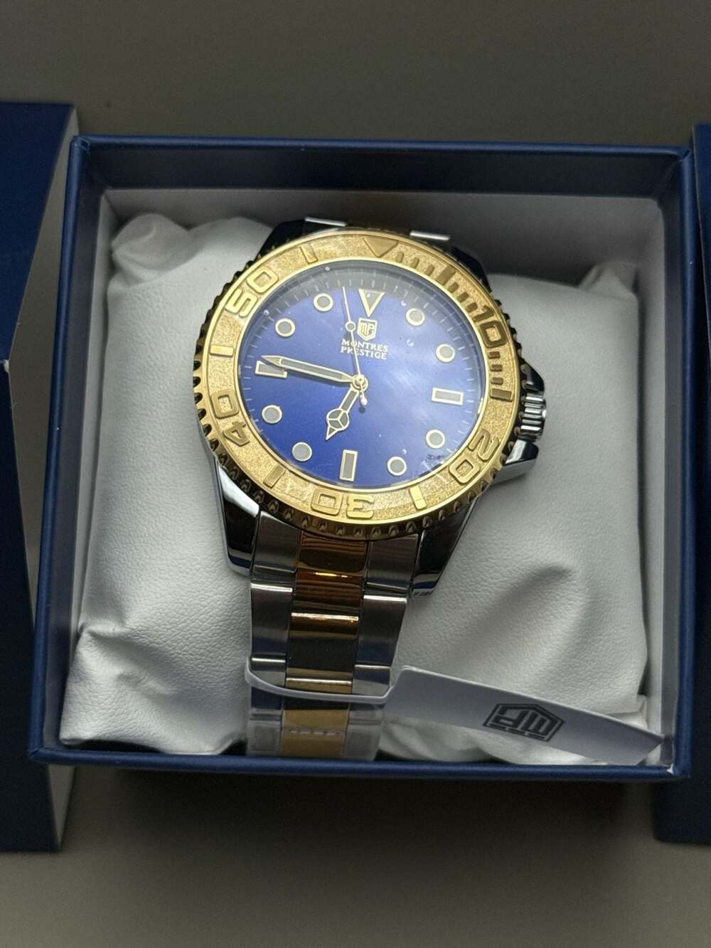 Montres Prestige Two-Tone Blue Dial Diver Style Watch with Gold Bezel